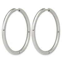 A pair of polished silver-toned hoop earrings with a thick tubular design and hinged closures.