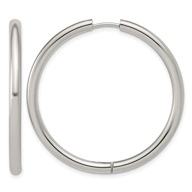 A pair of polished silver-toned chunky hoop earrings shown from the front and side view, displaying their smooth cylindrical tubing and hinged closure.