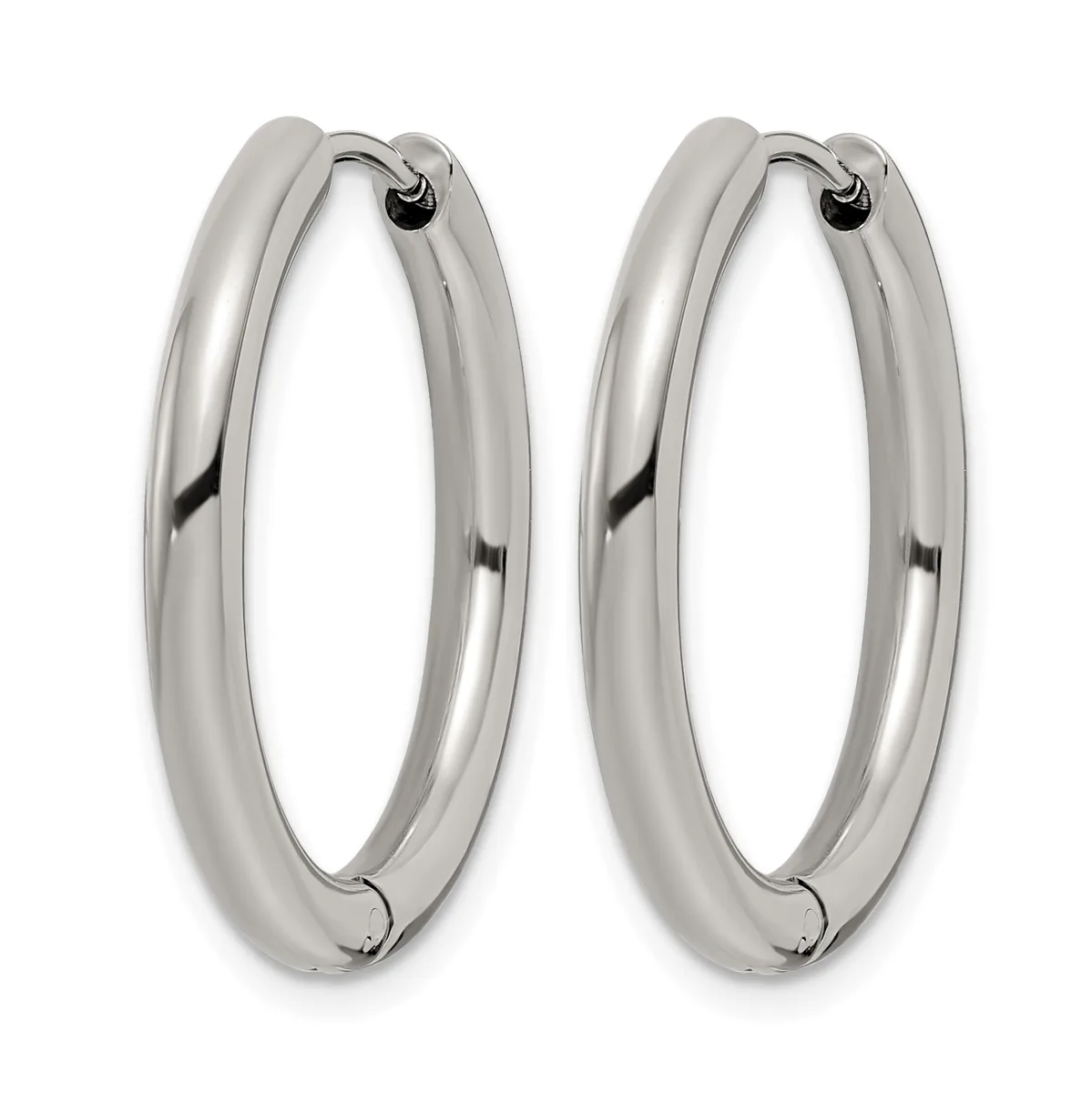 A pair of polished silver-toned hoop earrings with a thick, rounded profile and hinged closures, displayed side by side.