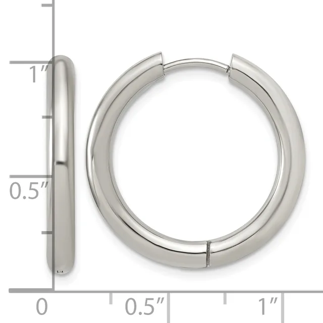 Silver-toned chunky hoop earrings with a polished finish, shown from front and side views with measurement scale indicating approximately one inch diameter and half inch thickness.
