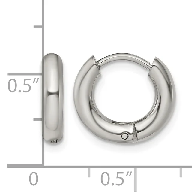 A pair of polished silver-toned chunky hoop earrings with a half-inch width, shown from front and side views with measurement scale.