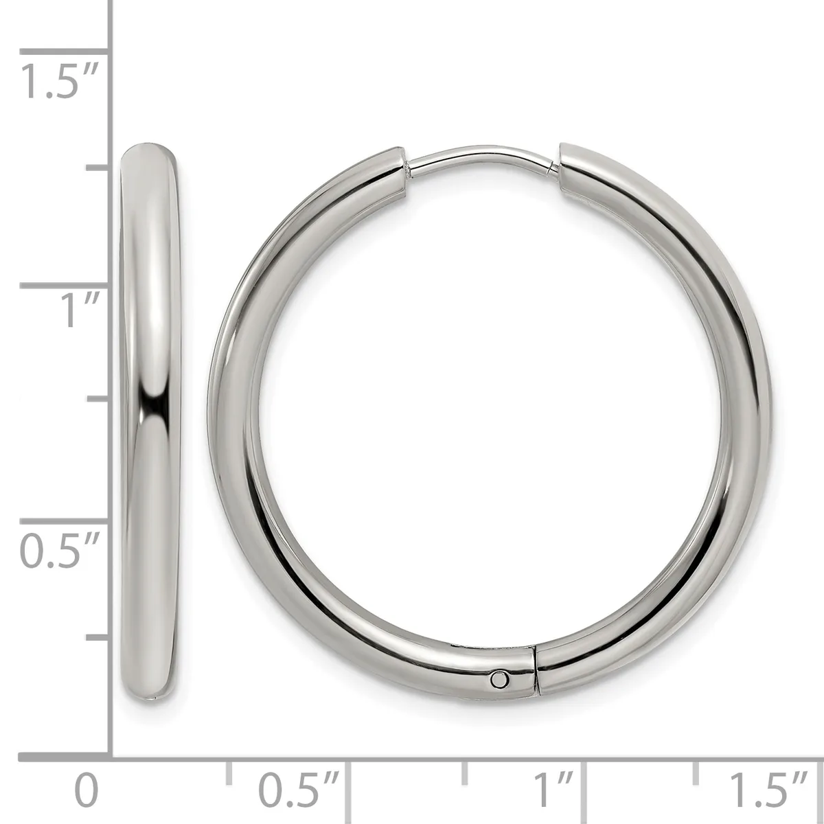 A pair of polished silver-toned hoop earrings displayed next to a ruler showing their dimensions of approximately 1.25 inches in diameter.