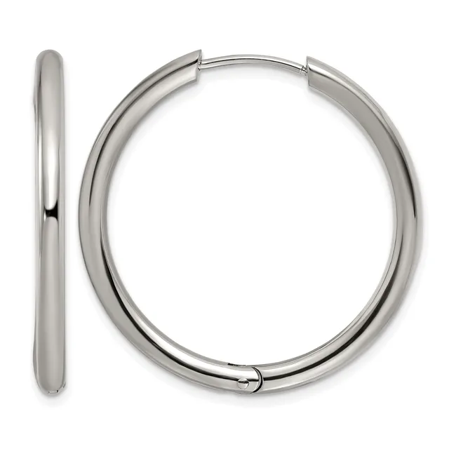 A pair of polished silver-toned hoop earrings with a chunky tubular design and hinged closures, shown from the front and side views.