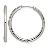 A pair of polished silver-toned hoop earrings with a chunky tubular design and hinged closures, shown from the front and side views.