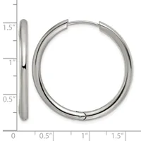 A pair of polished silver-toned hoop earrings shown from the side and front, measuring 1.5 inches in length with a thick tubular design.