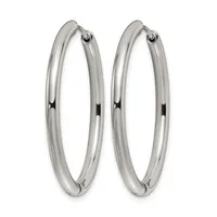 A pair of polished silver hoop earrings with a smooth, rounded tubular design and small hinged closures at the top.