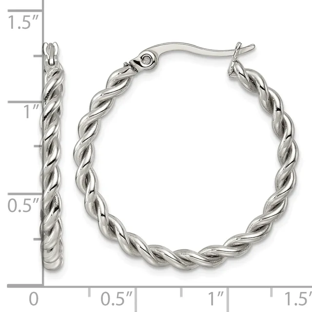 Silver-toned twisted hoop earrings with fish hook closures, shown from front and side views with measurement scale indicating approximately 1.5 inches in length.