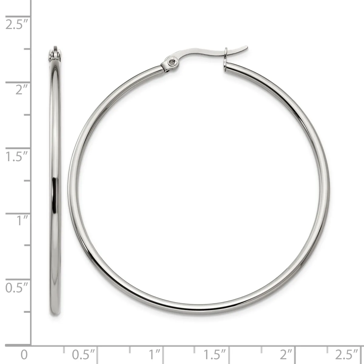 A pair of polished silver-toned hoop earrings displayed next to a ruler showing they measure approximately two inches in diameter.