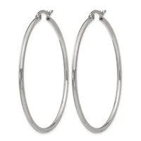 A pair of polished silver-toned hoop earrings with a smooth, rounded profile and post-and-clutch closures.