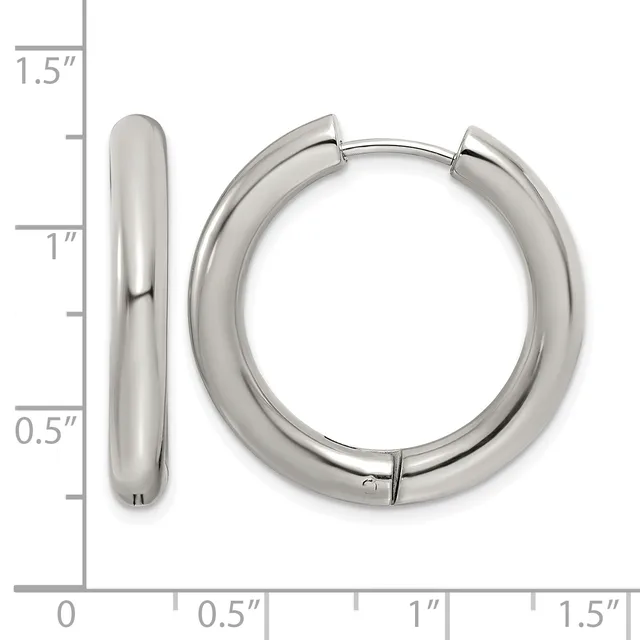A pair of polished silver-colored chunky hoop earrings with a smooth rounded profile, displayed next to a measurement ruler showing approximately 1.5 inches in length.