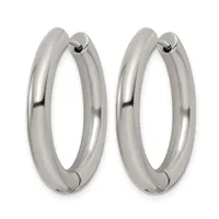 A pair of polished silver-toned chunky hoop earrings with hinged closures, displayed side by side against a white background.