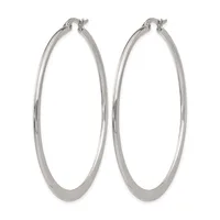 A pair of polished silver-toned hoop earrings with a thick, smooth band and hinged closures, displayed against a white background.
