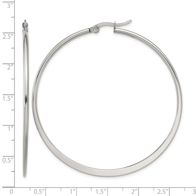 A pair of silver hoop earrings with a hinged closure, shown next to a ruler indicating they measure approximately 2.5 inches in diameter.