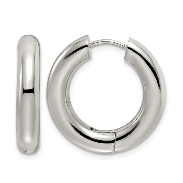 A pair of polished silver huggie hoop earrings with a chunky, curved rectangular profile, shown from the front and side.
