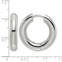 A pair of polished silver-toned chunky hoop earrings displayed against a measurement scale showing they are approximately one inch in diameter.