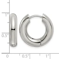Polished silver-tone chunky hoop earrings with a hinged closure, displayed next to a ruler showing approximately one inch in height and half inch in width.