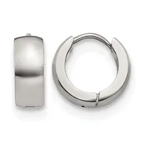 A pair of polished silver-toned chunky hoop earrings displayed from front and side views, shown against a white background.