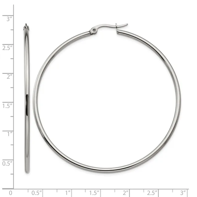 A pair of silver hoop earrings displayed next to a ruler showing their size of approximately 2.5 inches in diameter.