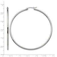 A pair of silver hoop earrings displayed next to a ruler showing their size of approximately 2.5 inches in diameter.