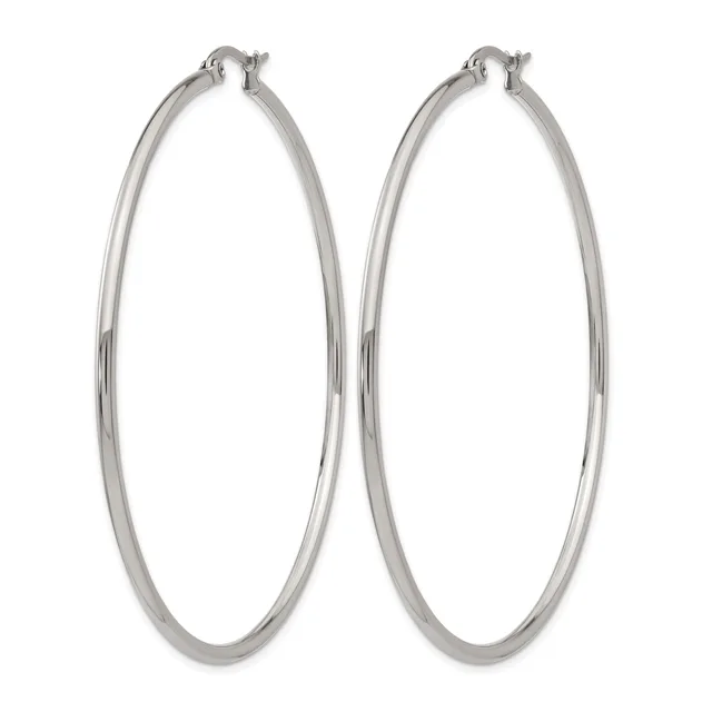 A pair of polished silver-toned hoop earrings with a smooth, rounded tubular design and hinged closures, shown against a white background.