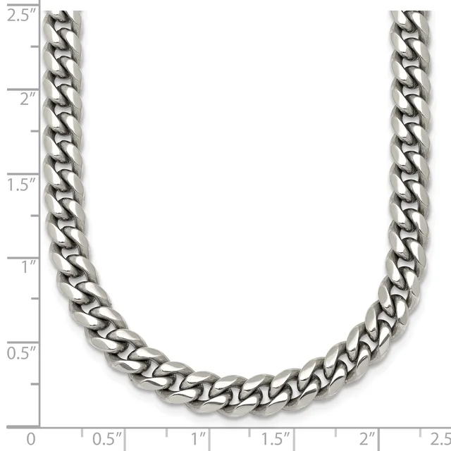 A silver-toned curb chain necklace displayed against a ruler showing its length of approximately 2.5 inches width.
