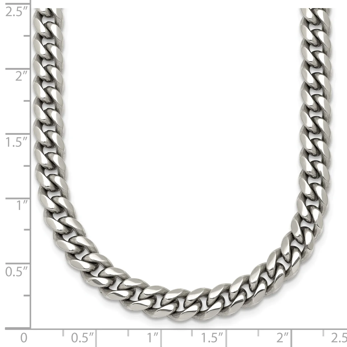A silver-toned curb chain necklace displayed against a ruler showing its length of approximately 2.5 inches width.