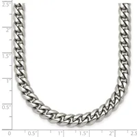 A silver-toned curb chain necklace displayed against a ruler showing its length of approximately 2.5 inches width.