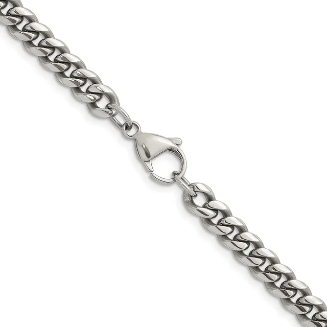 A silver curb chain bracelet with a lobster claw clasp, displayed diagonally against a white background.