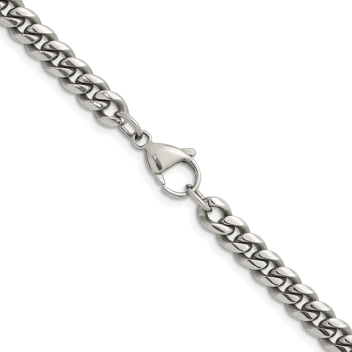 A silver curb chain bracelet with a lobster claw clasp, displayed diagonally against a white background.