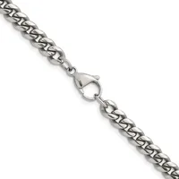 A silver curb chain bracelet with a lobster claw clasp, displayed diagonally against a white background.