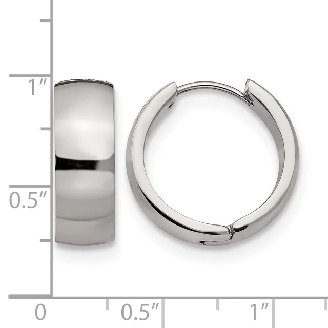 Two polished silver-tone chunky huggie hoop earrings shown from front and side views against a measurement scale indicating approximately one inch in length and half inch in width.
