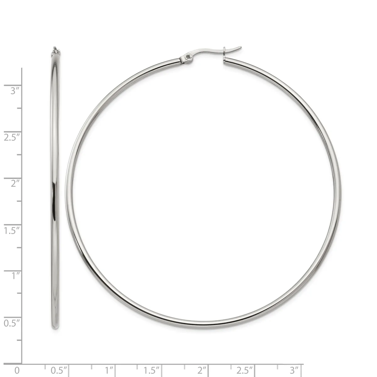 A pair of polished silver-toned hoop earrings displayed next to a ruler showing their diameter of approximately three inches.