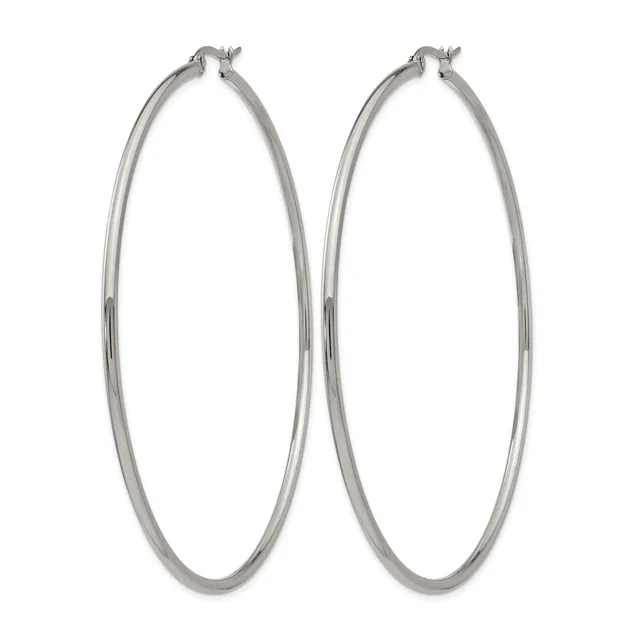 A pair of large silver-toned hoop earrings with a polished finish and hinged posts, displayed side by side against a white background.