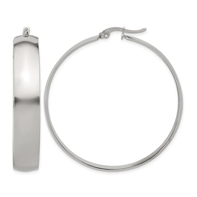 A pair of polished silver-toned hoop earrings shown from the front and side, featuring a chunky cylindrical design with a hinge and post closure.