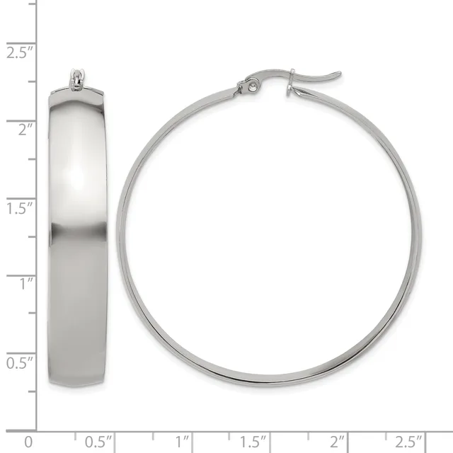 A pair of polished silver hoop earrings shown from front and side views with a measurement scale indicating approximately one inch in diameter and one-quarter inch in width.