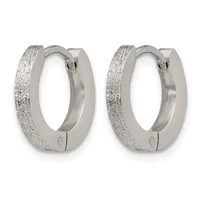 Pair of silver hoop earrings with a textured glitter finish on the outer surface and polished inner surface, shown from the front.