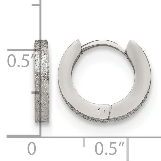 A pair of textured silver hoop earrings with a matte finish, shown front and side view against a measurement scale indicating approximately 0.5 inches in diameter.