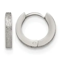 A pair of textured silver huggie hoop earrings shown from the front and side, displaying a brushed or hammered finish surface.