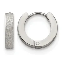 A pair of textured silver huggie hoop earrings shown from the front and side, featuring a sparkly sandblasted finish and a small hinged closure.