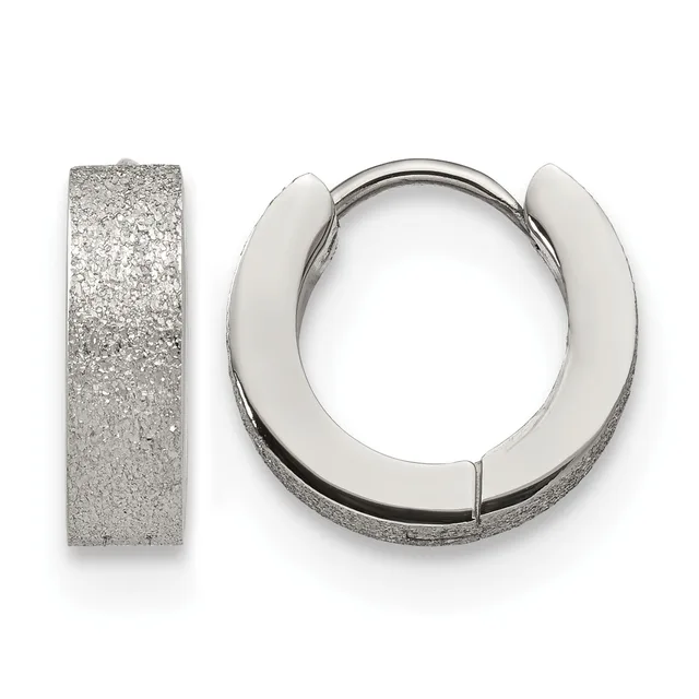 Pair of silver huggie hoop earrings with a textured frosted finish shown from the front and side view against a white background.
