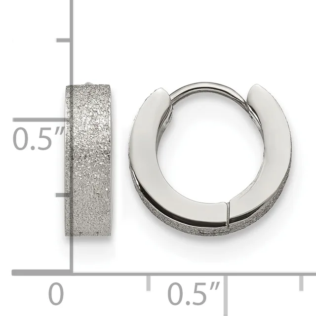 Pair of textured silver hoop earrings with a half-inch width, shown front and side view against a measurement grid.
