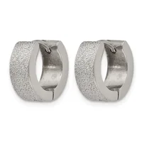 A pair of silver-toned chunky hoop earrings with a textured frosted finish and hinged closures, shown from the front.