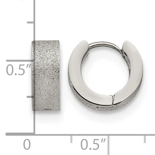 Two silver-toned stainless steel hoop earrings with a textured frosted finish, displayed next to a measurement scale showing 0.5 inch width.