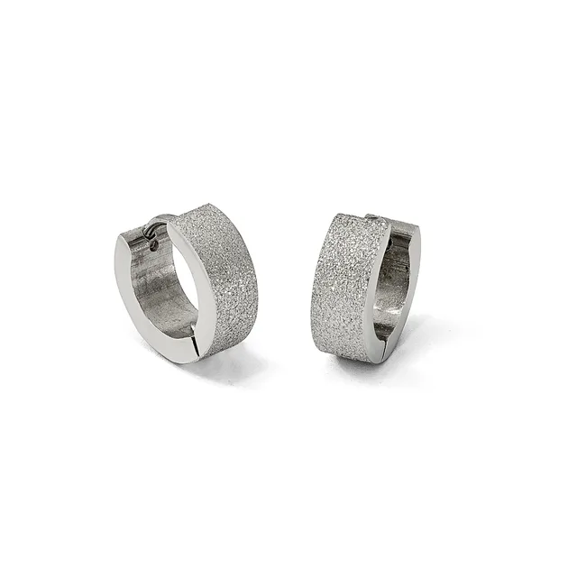 A pair of textured silver huggie hoop earrings with a frosted finish shown from two angles against a white background.