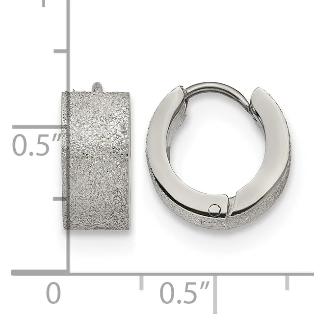A pair of textured silver hoop earrings with a frosted finish, shown next to a measurement scale indicating they are approximately 0.5 inches in height.