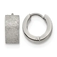 A pair of rectangular and circular silver-textured huggie earrings with hinged closures displayed against a white background.