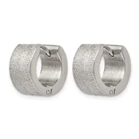 A pair of chunky silver huggie earrings with a textured surface and hinged closures, shown from the front.
