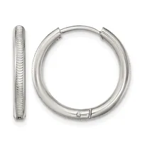 A pair of polished silver hoop earrings with textured surface detail, shown from front and side views.