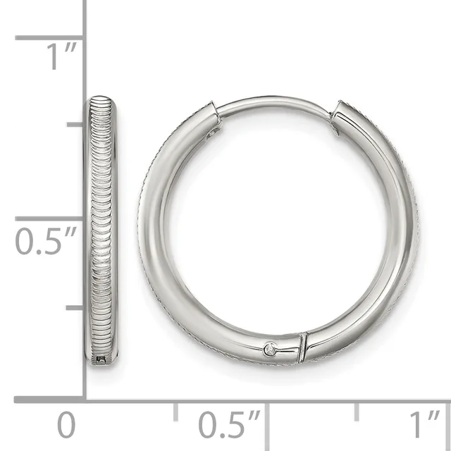A pair of textured silver hoop earrings with a measurement scale showing they are approximately one inch in diameter.