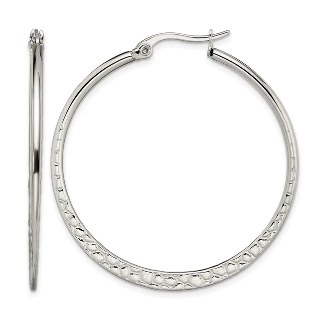 A pair of silver-toned hoop earrings with textured surfaces and hinged closures, shown from front and side views.